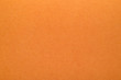 Bright orange texture of cardboard. Rough surface for background