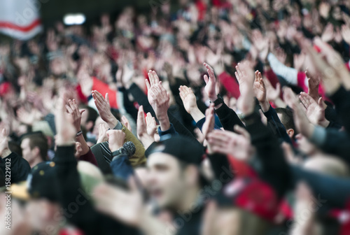 Football fans clapping on the podium of the stadium Poster