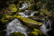 Mossy Boulders With Rushing Water
