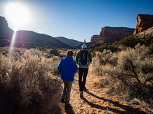 Father And Son Hiking In The Colorado National Monument