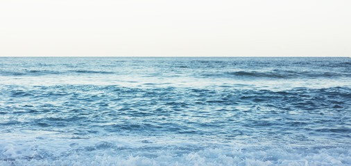 Waves of blue quiet ocean coast landscape. Background sea scape and sand beach coastline. Panorama horizon perspective view nature hiliday. Travel summer concept, backdrop water seascape, mock up