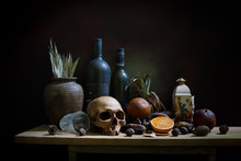 Skull And Objects Expired And Dried And Rotten Fruits On The Plank In Dim Light Night / Still Life Style  And Select Focus, Space For Text.