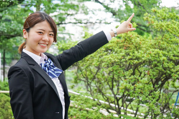 Wall Mural - Student pointing to something in uniform