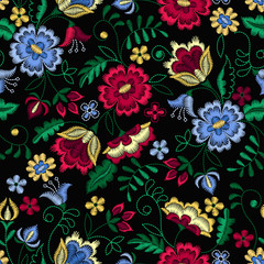 Embroidery seamless pattern with beautiful flowers. Vector floral ornament on black background. Embroidery for fashion textile and fabric.