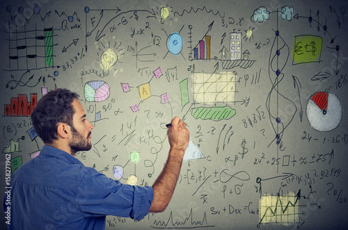 Fotografía Smart man analyzing human needs writing self development and business plan