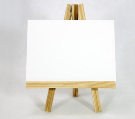Wall Mural - Easel with blank white card. Copy space.