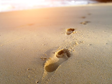 Footprints On The Tropical Sand Beach Great For Vacation Adverts