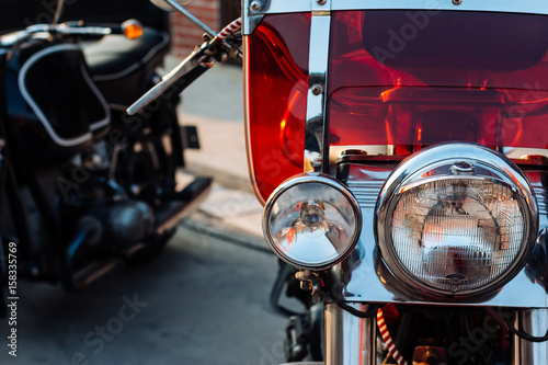 Close-up view on retro motorcycle headlights. Obraz na płótnie