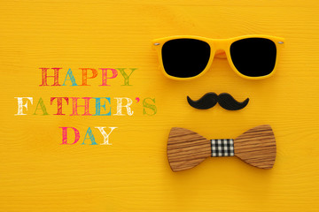 Wall Mural - Father's day concept. Hipster yellow sunglasses and funny moustache