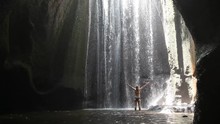 Woman With Raised Hands In Waterfall, Yoga, Beautiful Girl Practices In Waterfall, Body And Mind Harmony In The Nature