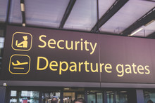 Information Sign Showing Way To Departures And Security At Heathrow Airport In London