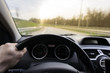© Mak - Close-up of hands on a steering wheel