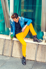 Wall Mural - Young man holding white rose, thinking, sitting outside in New York