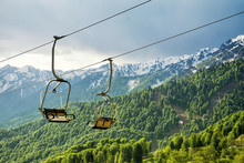 A Canopy Chairlift In The Background Of The Mountains In The Summer. Rosa Khutor, Adler