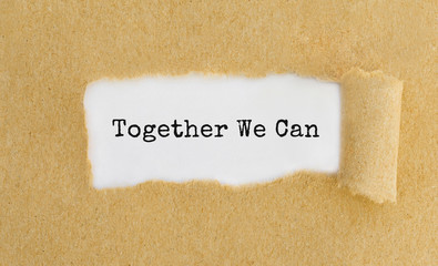 Poster - text together we can appearing behind ripped brown paper