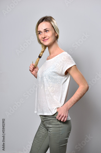 Blond Girl On White Background Holds Her Dyed Hair Buy This