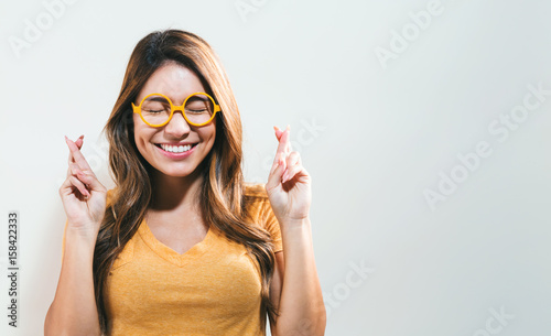 Fotografía Young woman wishing for good luck