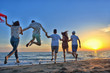 © FS-Stock - Group of happy young people is running on background of sunset beach and sea
