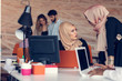 © FS-Stock - Two woman with hijab working on laptop in office.