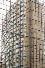 Canvas Print - Building Reflected in Glass Wall