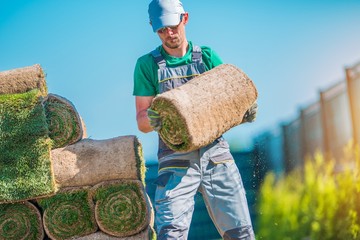 Wall Mural - Gardener with Piece of Turf