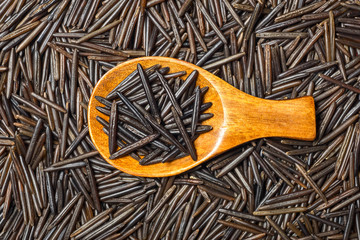 food background of black wild rice, top view