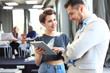 © opolja - Business team work process modern office.Photo professional crew working with new startup project. Project managers meeting. Analyze plans.Coworking world. Blurred background, film effect.Horizontal