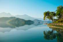 Reflection Of Trees, Mountains, And Islands On The Clear Water Lake, Sun Moon Lake. The Lake Has Very Clear Water And Can Reflect Trees And Mountains On Its Surface. 