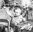 © acrogame - Toddler happy under the Christmas tree - engraving from XIX century