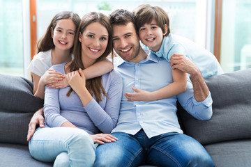 Poster - Family relaxing on sofa
