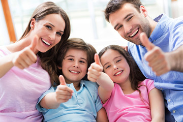 Wall Mural - Family relaxing on sofa
