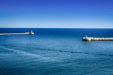 Wall Mural - The lighthouse and the harbor entrance in Valleta,Malta