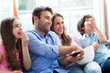 © pikselstock - Family watching TV