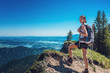 © XtravaganT - Female Hiker Admiring Nature on Mountain Summit