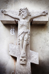 Wall Mural - crucifixion of Jesus Christ as a symbol of resurrection and immortality of the human soul (ancient stone statue)