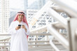 © Jestercine - Arab man use smartphone  in city, 20s age.