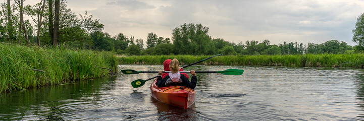 Wall Mural - Two girls kayaking panorama