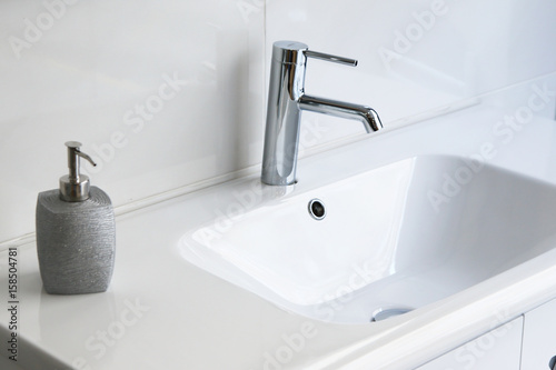 Fotografía modern and clean toilet, sink and toiletries