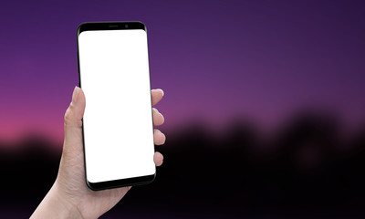 Poster - Hand showing modern smart phone with round edges. Isolated, white screen for mockup, app, user interface, web site, design promotion. Blurred background. Free space for text.