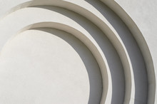 Abstract Lines Of Arches In A White Plastered Wall. Abstract Background With Flowing Lines. Architecture Backdrop