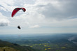 People fling paragliding over the Friulian plain.