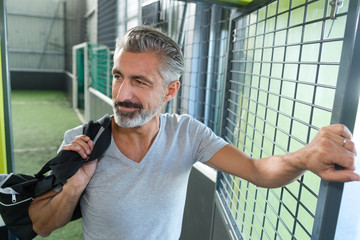 sports coach standing on a field