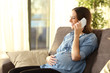 © Antonioguillem - Pregnant woman talking on mobile phone