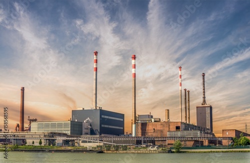 Fotografía Industry concept. Factory or refinery at sunset.