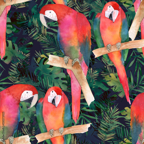 Watercolor seamless pattern with colorful parrots and tropical leaves. Exotic...