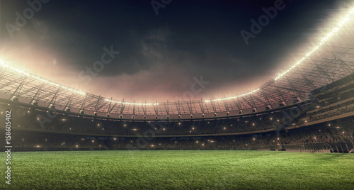 Soccer Stadium With Green Grass Illumination Lights And Dramatic Night Sky Poster Tandembranding