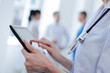 © zinkevych - Capable medic using digital gadget at the clinic