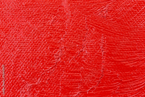 Fotografie, Obraz Wet red paint on an artist canvas close view.
