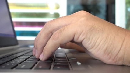 Poster - Man hands typing on a laptop computer keyboard