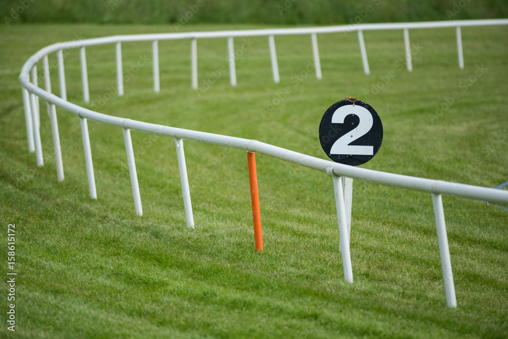 Long Races Barriers Horse racetrack railing barrier and furlong Distance marker Stock Photo ...